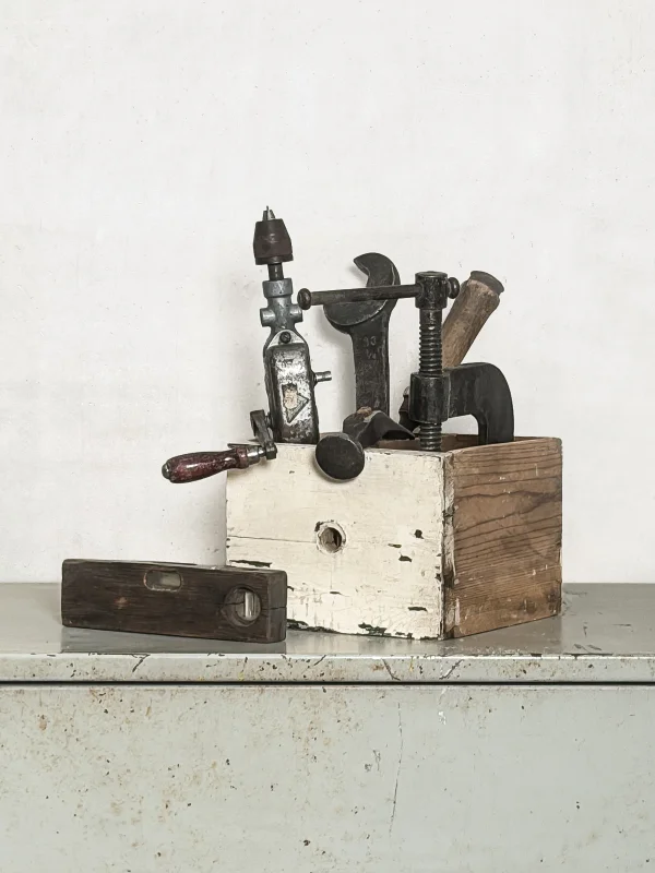 Tool set in old wooden drawer